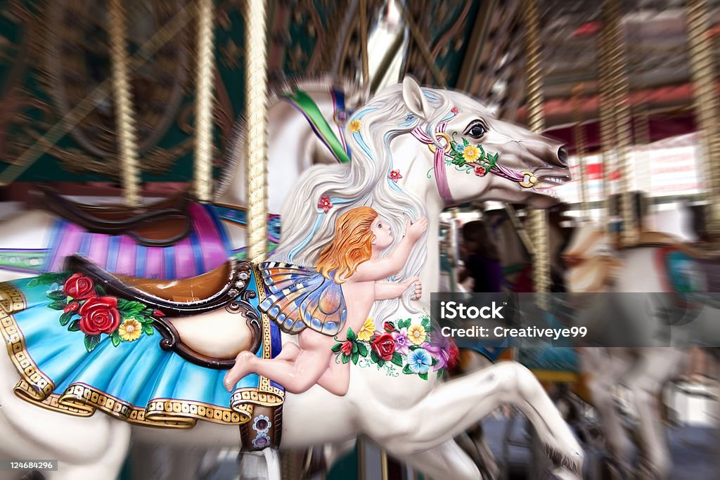 Carousel horse Carnival horse ride with motion blur and shallow DOF. Agricultural Fair Stock Photo