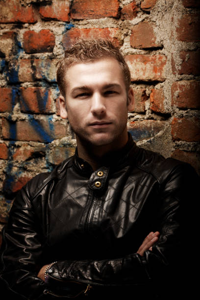 Young caucasian male with expression in urban setting