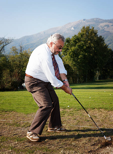 Businessman in a Golf Course. Color Image  golf concentration stock pictures, royalty-free photos & images