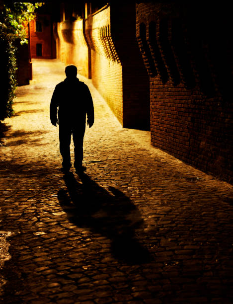 istock Man Walking in Medieval Alley. Color Image 124685900