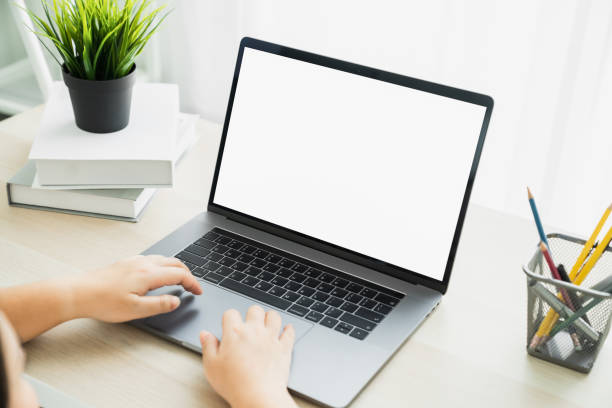 istock Woman hand using laptop and type on the keyboard. Mockup screen of advertisement. 1246867175