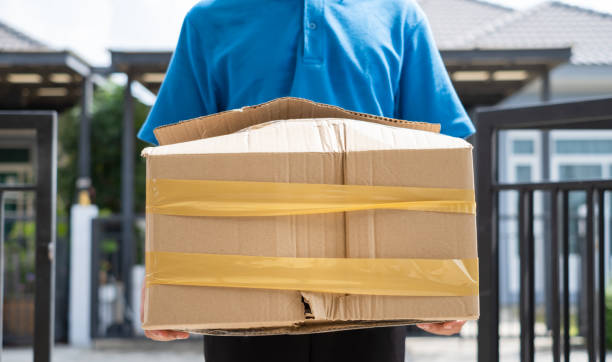 istock Delivery man Frightened with cardboard box damaged broken accident before delivering to customers at home, Express service client online shopping comfortable payment package product. 1246870835