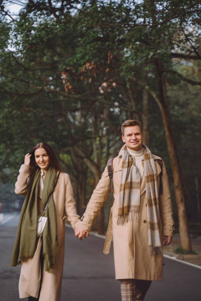 istock newlywed couple showing affection and holding hands as they are walking through the zhangjiajie national forest park 1246876197