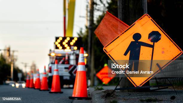 Lane Closure On A Busy Road Due To Maintenance Signs Detour Traffic Temporary Street Work Orange Lighted Arrow Barrels And Cones Stock Photo - Download Image Now