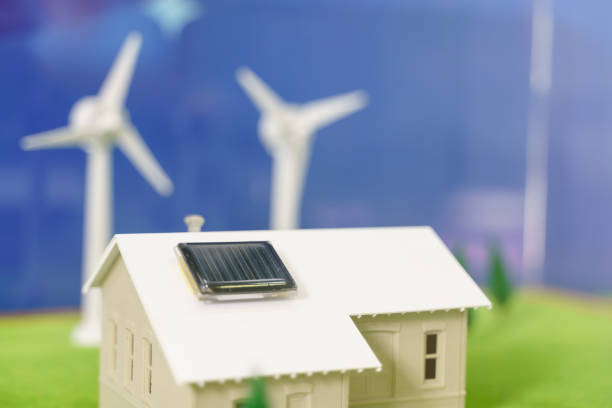 istock Solar cell panel on the roof tile of toy house 1246894559