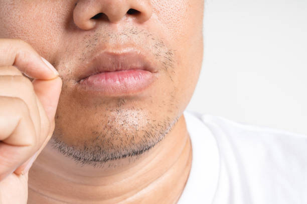 istock Asian man touch and picking new short beard and mustache 1246896143
