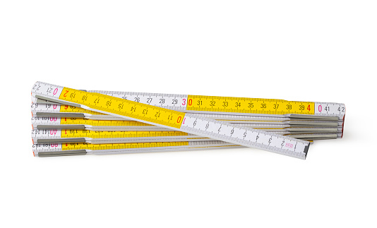 Yellow and white wooden folding ruler isolated on white background. Photo with clipping path.