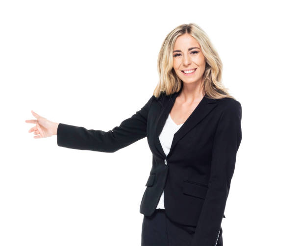 istock Caucasian female presenter standing in front of white background 1246907035