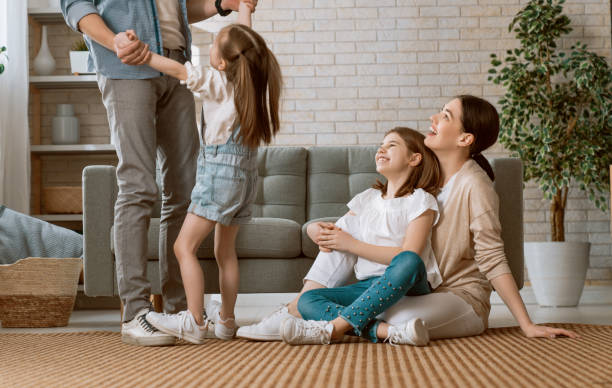istock Two children with mother and father. 1246907915