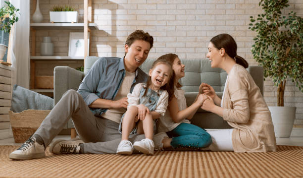 istock Two children with mother and father. 1246907922