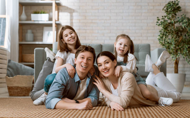 istock Two children with mother and father. 1246907932