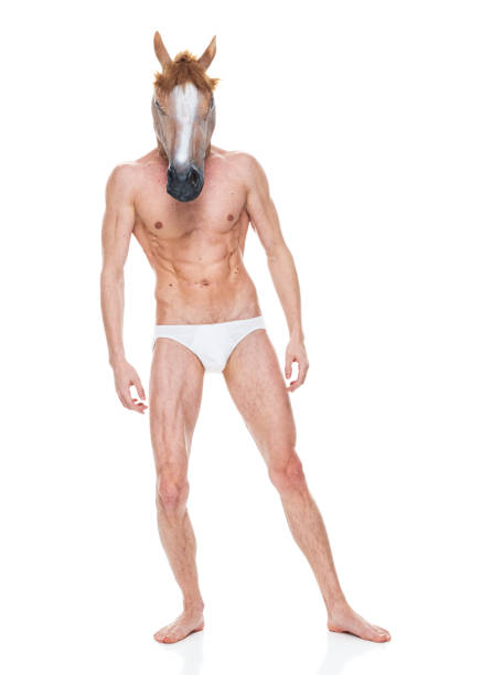 caucasian male standing in front of white background wearing costume - shirtless men bizarre male imagens e fotografias de stock