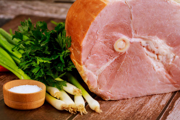 istock Pork ham with fresh parsley, onion and salt. 1246909938