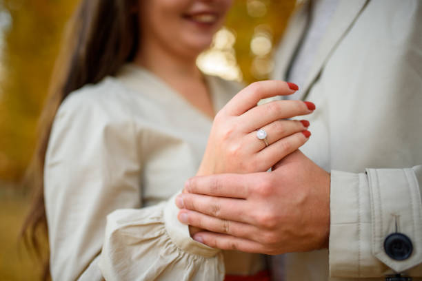 Wedding ring on a girl"u2019s finger. Engagement. stock photo