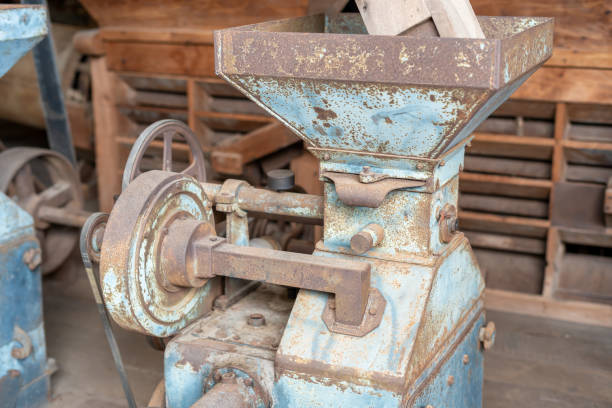 istock Blue rice paddy mill machine to make white rice grain That has been used for a long time until rusting in the rice mill 1246918659