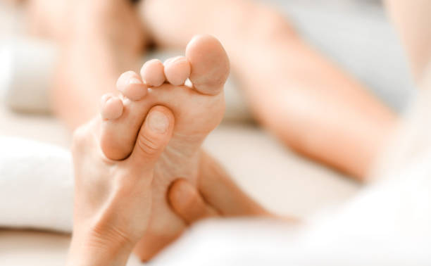 istock Professional therapist giving relaxing leg massage treatment 1246919708