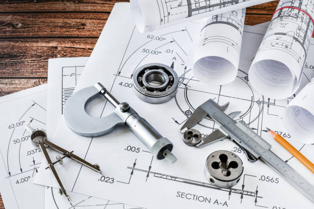 istock Engineer technicial drawings and  mechanical parts engineering industry work project paper prints. 1246919746