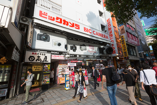 Tokyo, Japan - September 27, 2015 : Pedestrians walk past the the Bic Camera Shop in Ikebukuro, Tokyo, Japan. Bic Camera is a famous electronics retailer chain in Japan.