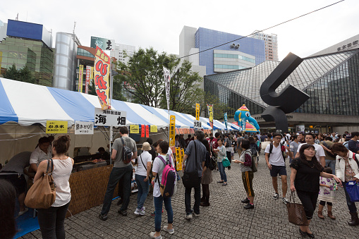 Tokyo, Japan - September 27, 2015 : People at the Fukuro Matsuri Festival in Ikebukuro, Tokyo, Japan. Many street vendors with games and selling Japanese festival food.
