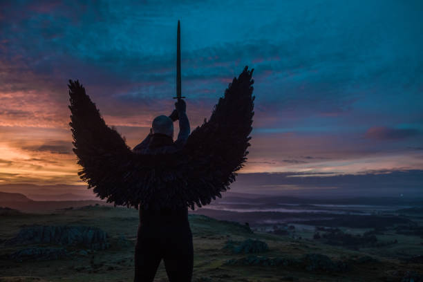 istock Black Winged Warrior Angel at dawn 1246923590