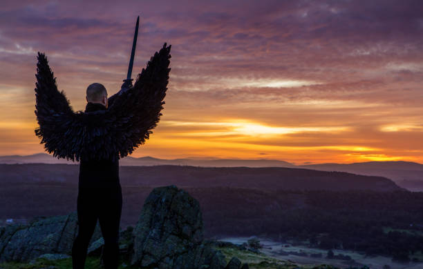 istock Black Winged Warrior Angel at dawn 1246923901