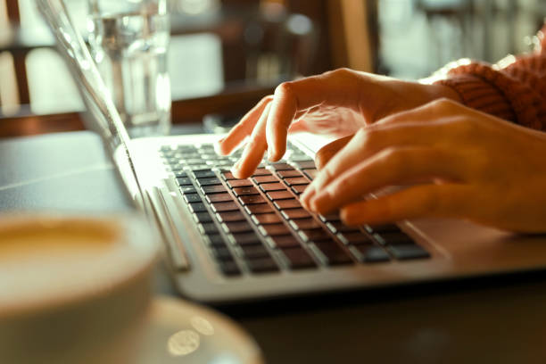 istock Unrecognizable woman using her laptop 1246928641