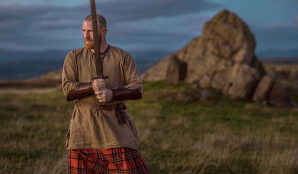 istock Scottish Redhead Warrior wearing a kilt 1246930212