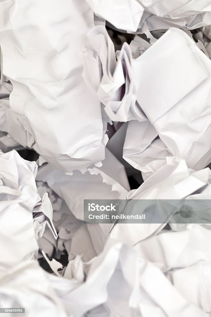 Crumpled paper background Cumpled white paper on a plain background. Can be used as a background. Black Background Stock Photo