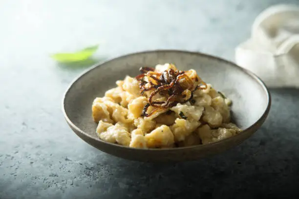 Traditional German noodles with cheese and fried onion