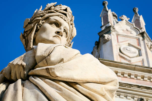 the statue of the poet dante alighieri in front of the basilica of santa croce in the historic heart of florence - alighieri imagens e fotografias de stock