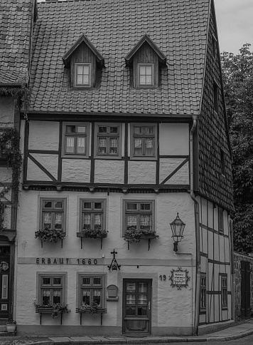 view of historical and ancient house in touristic city of Quedlinburg (Germany) in black and white
