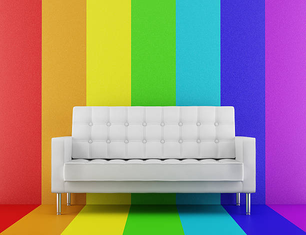 istock white couch in front of rainbow multicolored wall 124694376