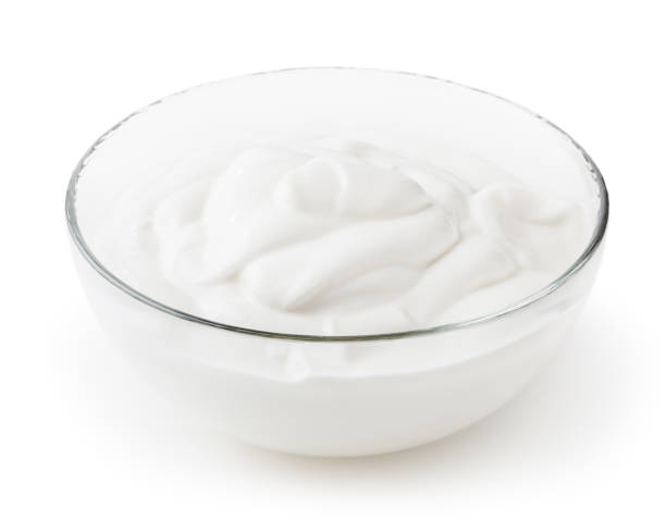istock Sour cream in glass bowl isolated on white background with clipping path 1246945577