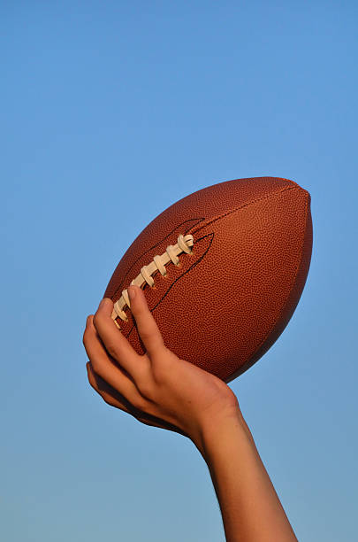 istock Quarterback Passing an American Football 124695028