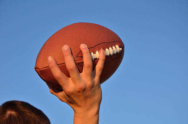istock Quarterback Passing an American Football 124695041