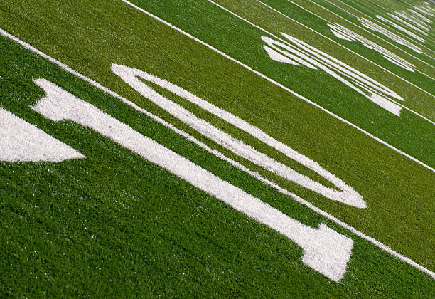 Football field stadium yard line marker on stadium field.