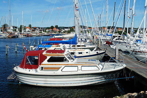 istock Yachts and boats lined up in a marina 124695291