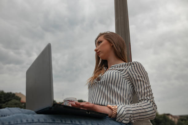 istock Girl working outdoors 1246955098