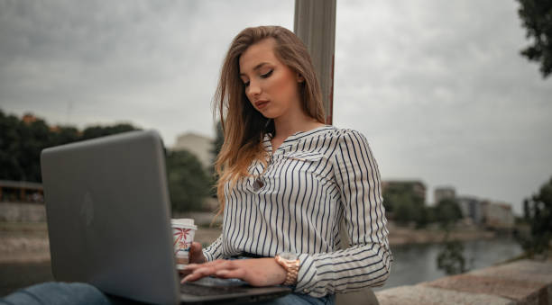istock Girl working outdoors 1246955106