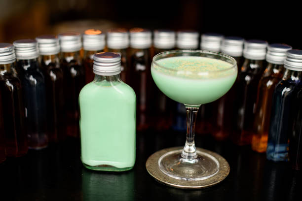 istock view on glass with grasshopper cocktail on bar counter. 1246966617