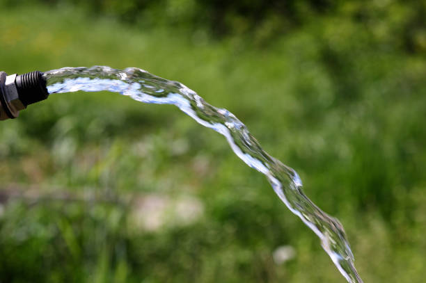 istock water pouring from a tap on a blurred natural background 1246967274