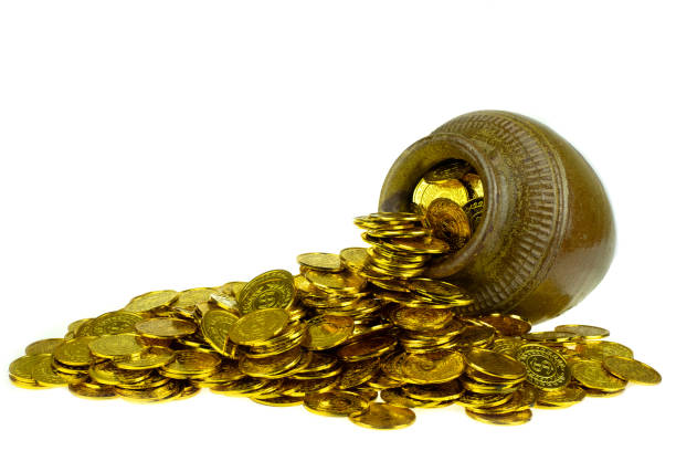 St. Patricks Day pot filled with chocolate gold coins on white background