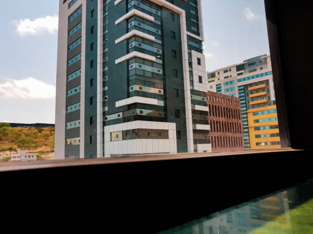 istock Window view of buildings 1246969475