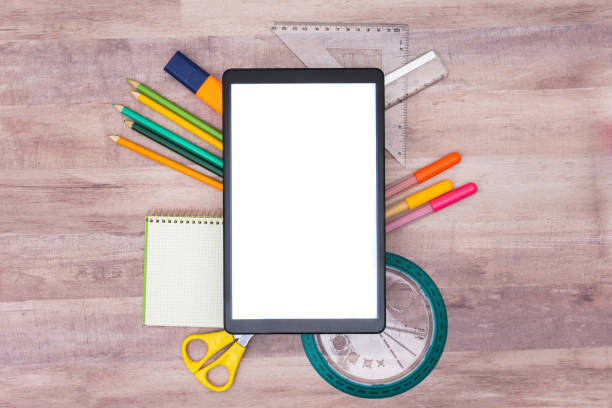istock tablet with school supplies underneath 1246975993