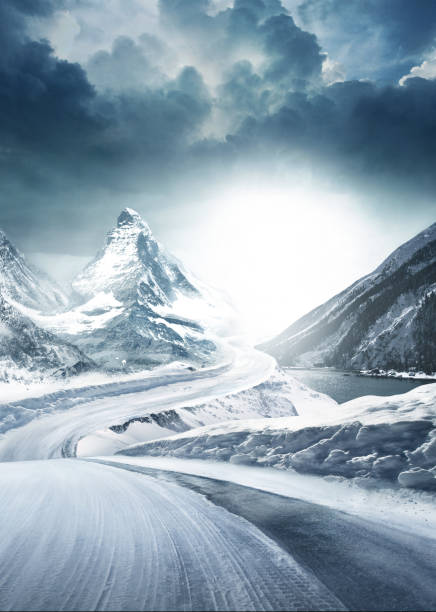 Difficult conditions on snowy road. Difficult conditions on snowy road. Snowy mountains in the background. Curvy roads. winding road photos stock pictures, royalty-free photos & images