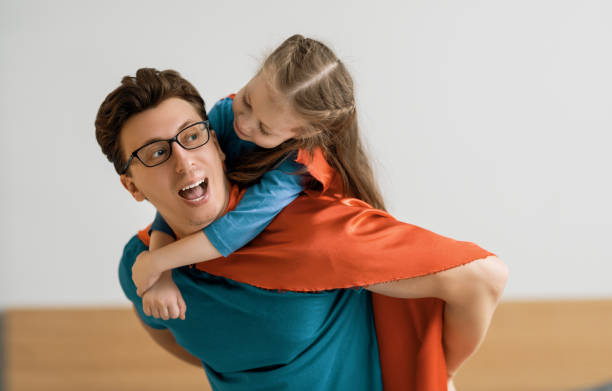 istock Girl and daddy in Superhero costume 1246984637