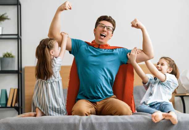 istock Girl and daddy in Superhero costume 1246984644