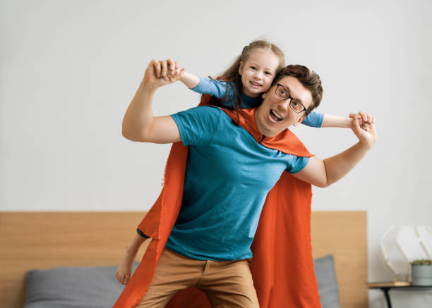istock Girl and daddy in Superhero costume 1246984645