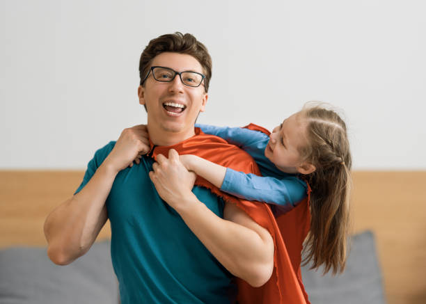 istock Girl and daddy in Superhero costume 1246984650