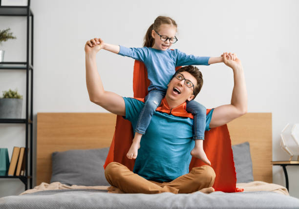 istock Girl and daddy in Superhero costume 1246984651